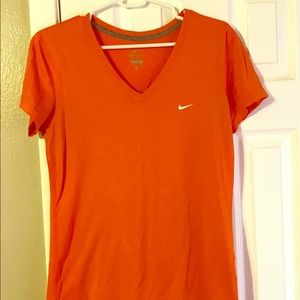 Orange Nike workout top